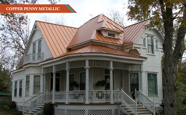 A Copper Penny Metallic style roof on a white two story Victorian era house with wrap around front porch.
