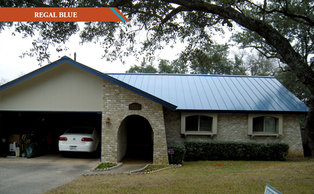 A Regal Blue metal roof on a white brick one story house.