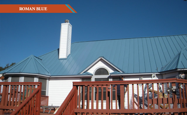 A Roman Blue style metal roof on a white two story house with red wood deck.