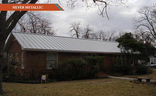 A Silver Metallic style roof on a red brick one story Ranch style house.