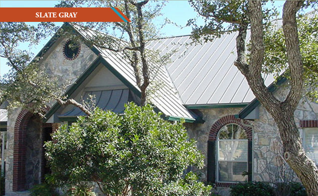 A Slate Gray style metal roof on a rick two story Tudor style house.