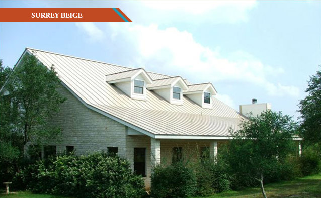 A Surrey Beige style metal roof on a white two story rock farm house.